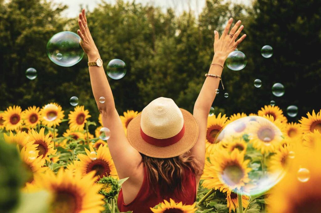 Daniela Martins, founder of The Joy in You, smiling and creating meaningful joyful design