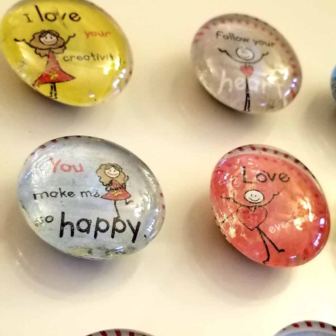 Close-up of The Joy in You magnetic buttons with motivational messages