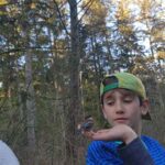 Daniela Martins with her son connecting with birds at the park